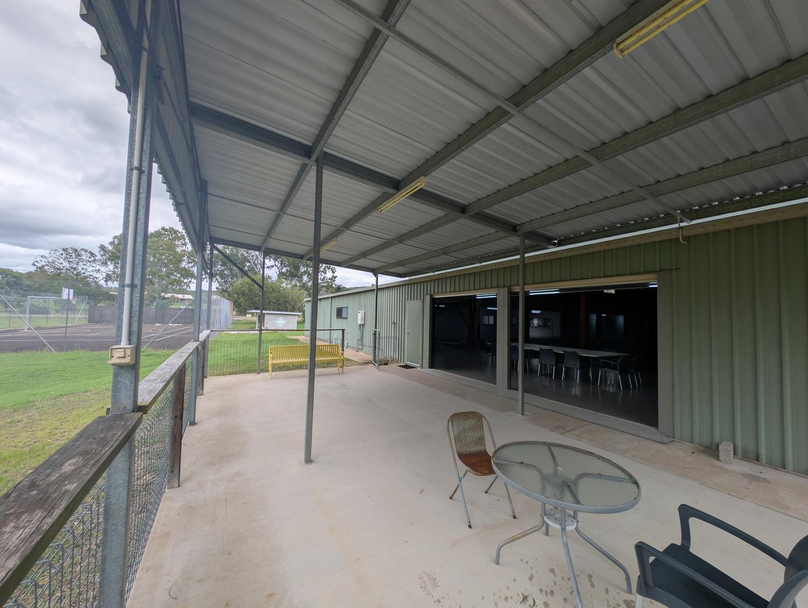 Outdoor tables and barbecue setup at the rec centre.